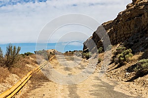 Eastern Washington Palouse vast expanse desert view rocky cliff dry grass and abandoned road