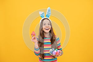 eastertide. time for fun. adorable funny kid on egg hunt. easter spring holiday. happy teen girl photo