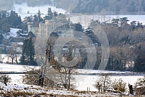 Eastnor, Herefordshire, UK. 12/19/2010 The fairytale Eastnor Castle on a snowy winters day.