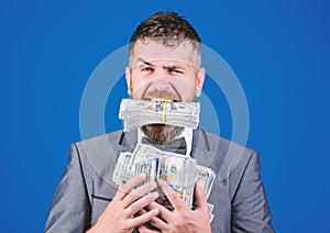Easy cash loan. Man formal suit hold many dollar banknotes blue background. Businessman got cash money. Take my money