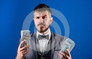 Easy cash loans. Man formal suit hold pile of dollar banknotes blue background. Businessman got cash money. Richness and