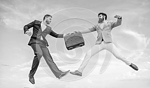 Easy deal business. Businessmen jump fly mid air while hold briefcase. Case with raise your business. Successful photo