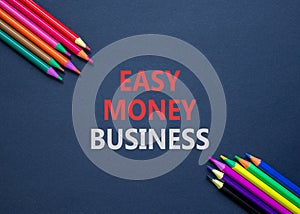 Easy money business symbol. Concept words Easy money business on beautiful black paper. Beautiful black table black background.