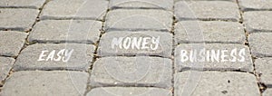 Easy money business symbol. Concept words Easy money business on beautiful grey paving slabs. Beautiful grey paving slabs