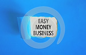 Easy money business symbol. Concept words Easy money business on beautiful white paper. Beautiful blue paper background. Easy