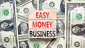 Easy money business symbol. Concept words Easy money business on beautiful wooden blocks. Dollar bills. Beautiful dollar bills