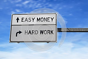 Easy money versus hard work. White two arrow road sign on metal pole