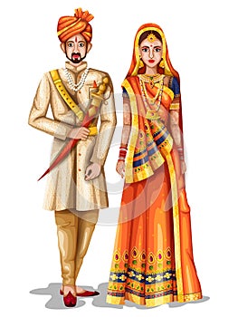 Rajasthani wedding couple in traditional costume of Rajasthan, India photo
