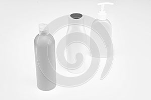 Easy to use. Toiletry bottles. Refillable bottles isolated on white. Beauty products packaging