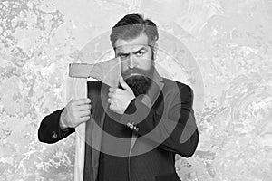 Easy way to style his moustache. Brutal hipster hold axe. Bearded man with stylish moustache. Moustache shaving with