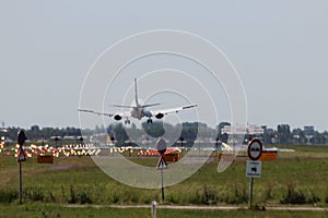 Easyjet Airbus aircraft landing on the landing strip of Amsterdam Schiphol Airport