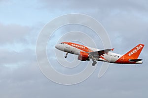 EasyJet Airbus A319-111 G-EZFZ passenger plane taking off from Amsterdam Schiphol Airport