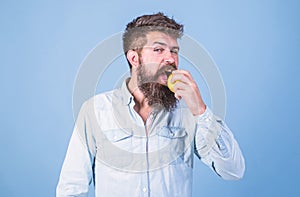 Eat apple can help lower blood sugar levels and protect against diabetes. Eat healthy. Man with beard hipster hold apple