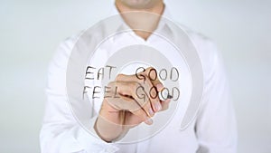 Eat Good Feel Good, Man Writing on Glass