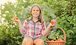 Eat healthy. Summer harvest concept. Organic harvest. Healthy lifestyle. Kid gathering vegetables nature background