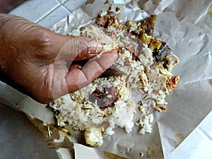 eat pork rice by hand. Makan Nasi Babi Guling Khas Bali