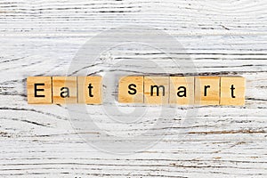 eat smart Word Written In Wooden Cube diet concept