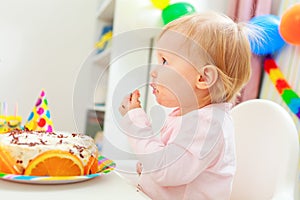 Eat smeared kid eating birthday cake