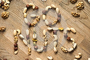 Eat various types of nuts on wooden background