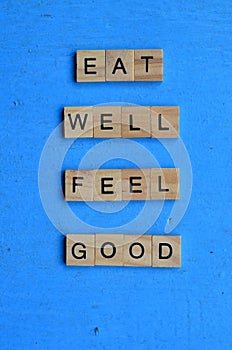 eat well feel good text on wooden square, motivation quotes.