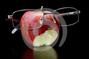 Eaten apple with glasses