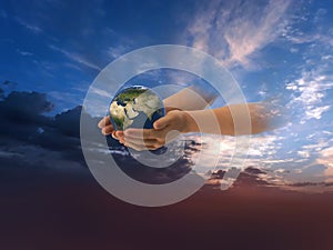 Eath  globe in hands on front blue cloudy sky hold peace concept natire background photo