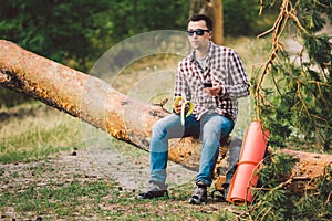 Eating banana Outdoors Hiking Trail. theme hiking and nature travel. Tourist take a rest and eating babanas. picnic in