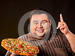 Eating contest pizza. Fat man eating fast food for overweight person.