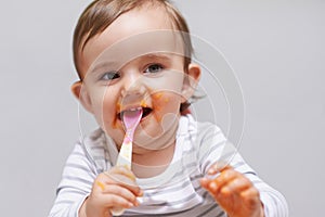 Eating, cute and boy baby in chair with vegetable food for child development at home. Sweet, nutrition and hungry young
