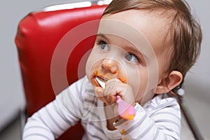 Eating, cute and boy baby in chair with vegetable food for child development at home. Sweet, nutrition and hungry young