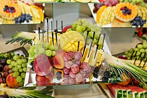 Eating at the event. Fresh Fruit Assortment on Elegant Mirror Platter