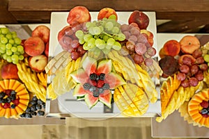 Eating at the event. Overhead View of Colorful Fruit Platter Arrangement
