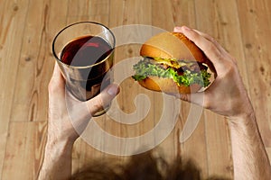 Eating Fast Food. Hamburger And Glass Of Soda. Dinner, Nutrition