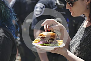 Eating fast food at  the 50th Annual University District Street Fair