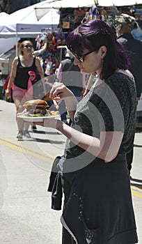 Eating fast food at  the 50th Annual University District Street Fair