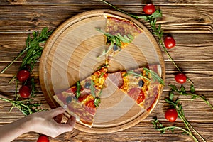 Eating Food. Close-up Of People Hands Taking Slices Of Pepperoni Pizza. Group Of Friends Sharing Pizza Together. Fast Food,