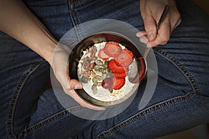 Eating healthy, breakfast bowl, Yogurt, granola, seeds, fresh fruits, bowl, woman` s hand, Clean eating, dieting, detox, vegetari