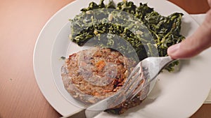 Eating healthy vegetarian or vegan food, real eggplant and carrot vegetable burger with spinach
