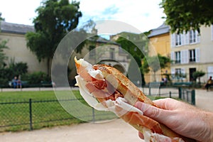 Eating a jamon buerre in Paris