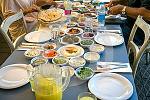 Eating a Mediterranean Meze Lunch at the port of Jaffa, Israel. Full of delicious foods and flavors.