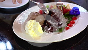 Eating melting chocolate lava cake with ice cream