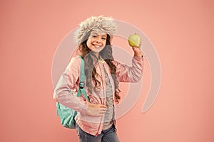 Eating natural food. Lunch time. Winter semester. Teen with backpack. Healthy snack. Modern education. Stylish