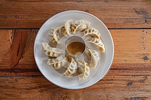 Eating Nepalese Traditional Dish Momo. Authentic Cuisine in Nepal