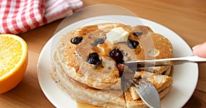 Eating pancakes with fork and knife