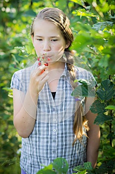 eating ripe wild strawberries