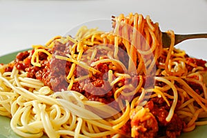 Eating spaghetti alla bolognese photo