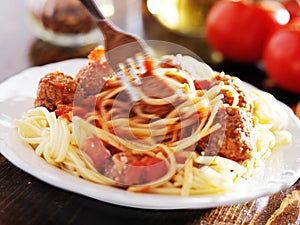 Eating spaghetti and meatballs with visable motion blur