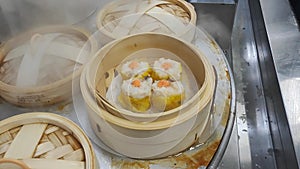 Eating steamed chinese dim sum in restaurant. famouse suimai in chinese restaurant