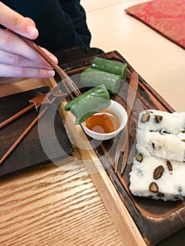 Eating sweet tteok korean rice cake in teahouse photo