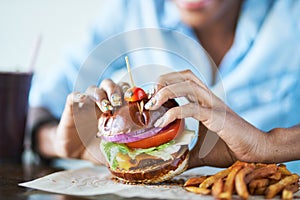 Eating vegan burger